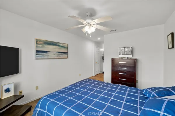 a room with a bed and a flat screen tv