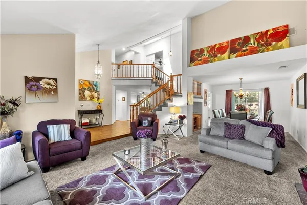 a living room with furniture or couch and a dining table