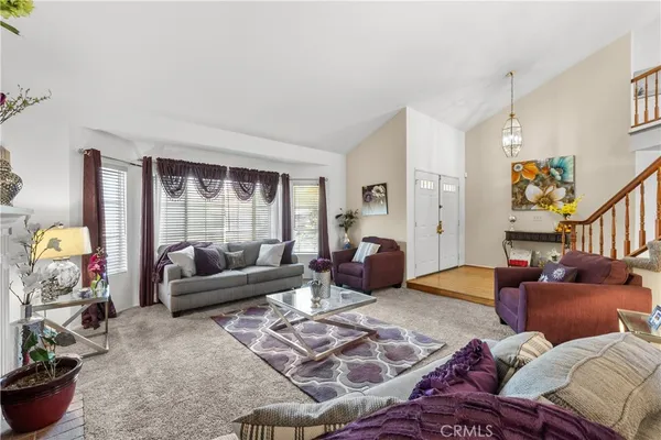 a bedroom with furniture and a potted plant