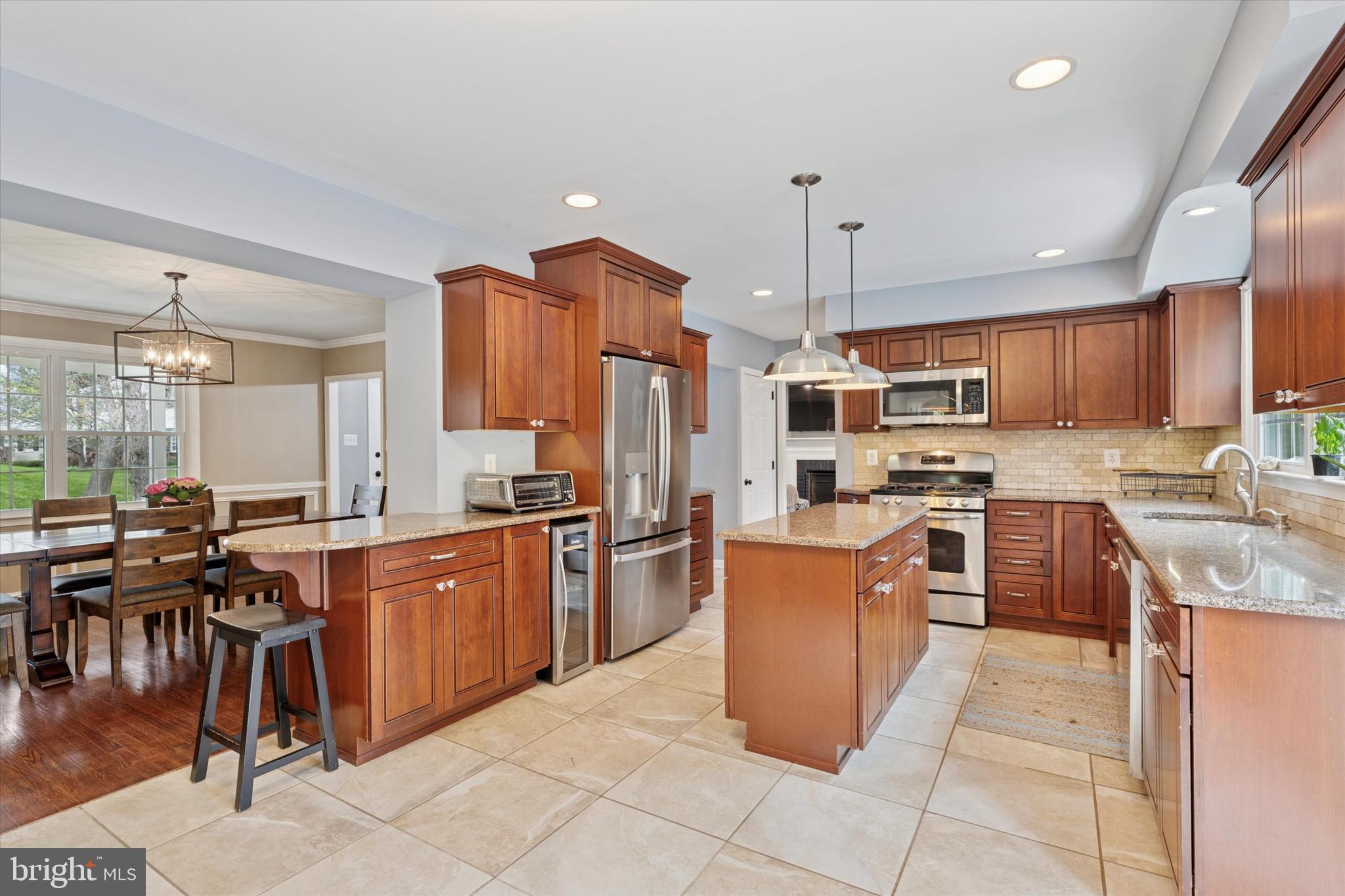 78 Peddrick Road Wayne, PA 19087 - Photo 13 of 47 a kitchen with a sink a counter top space appliances and cabinets