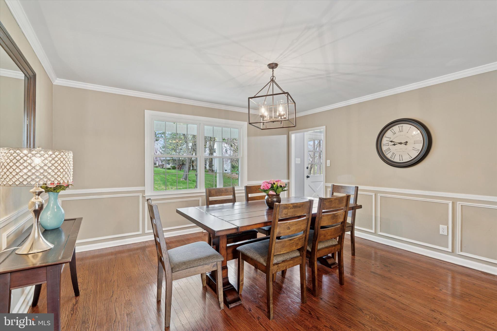 78 Peddrick Road Wayne, PA 19087 - Photo 17 of 47 a view of a dining room with furniture a chandelier and wooden floor