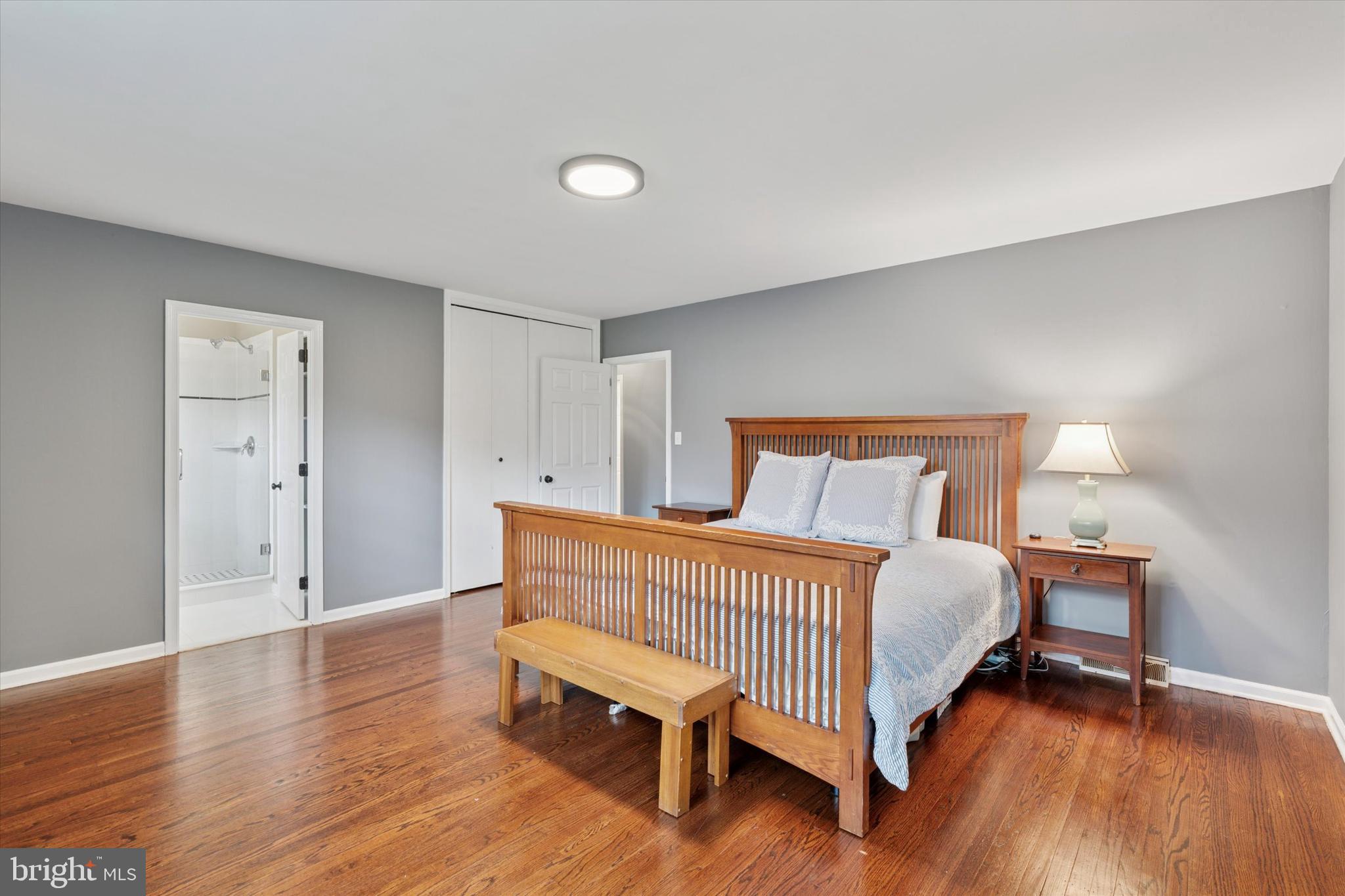 78 Peddrick Road Wayne, PA 19087 - Photo 20 of 47 a bedroom with a bed and wooden floor