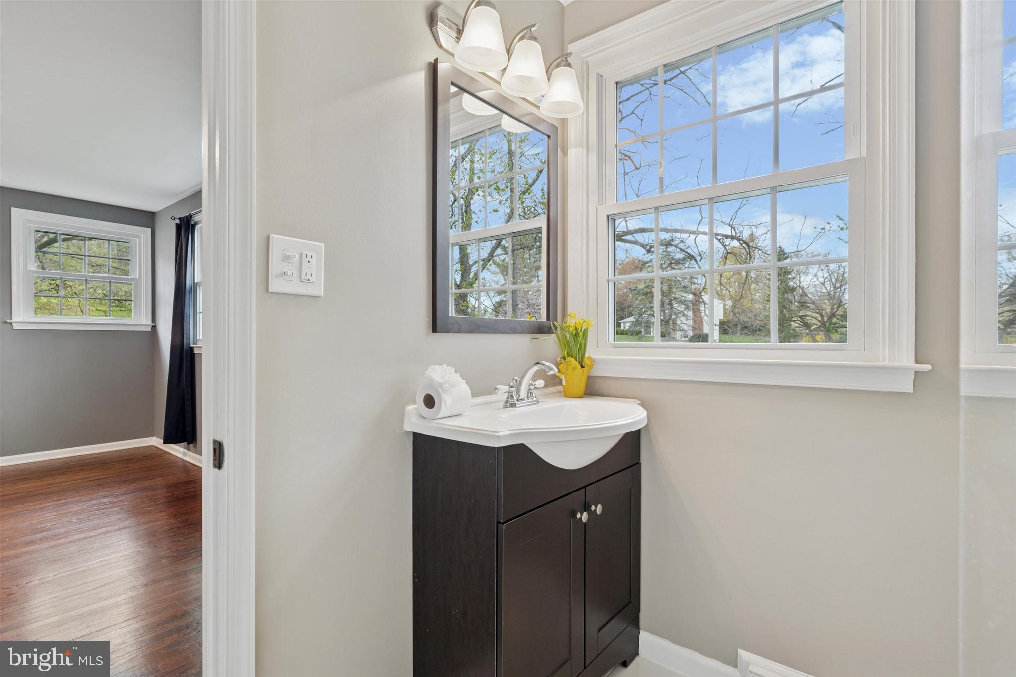 78 Peddrick Road Wayne, PA 19087 - Photo 23 of 47 a sink with window and wooden floor