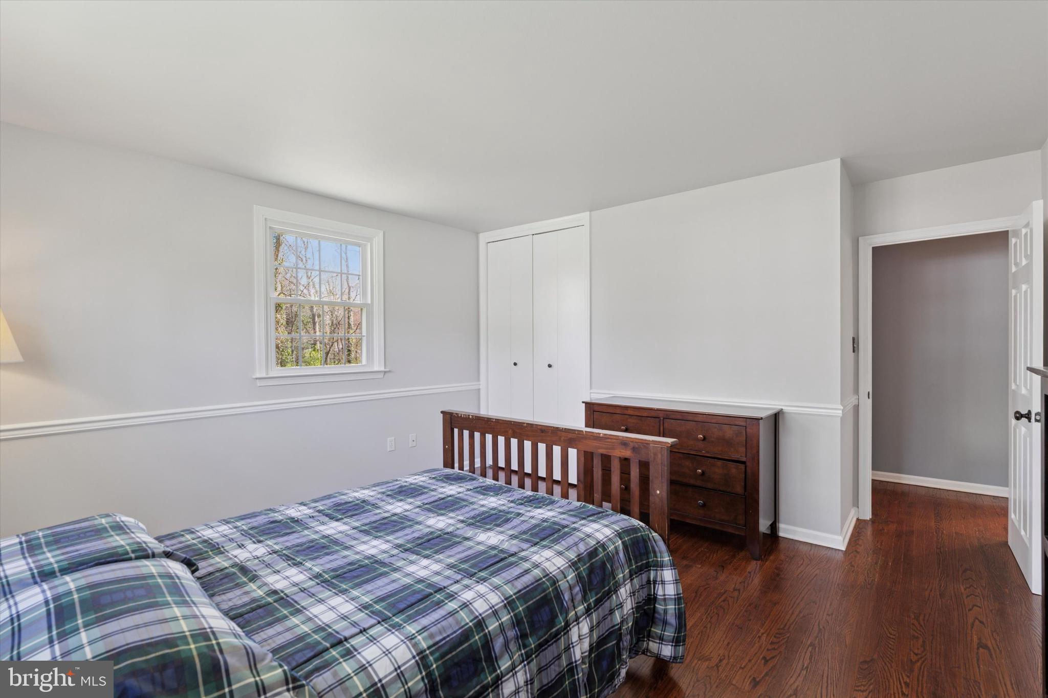 78 Peddrick Road Wayne, PA 19087 - Photo 25 of 47 a bedroom with a bed next to a window with wooden floor