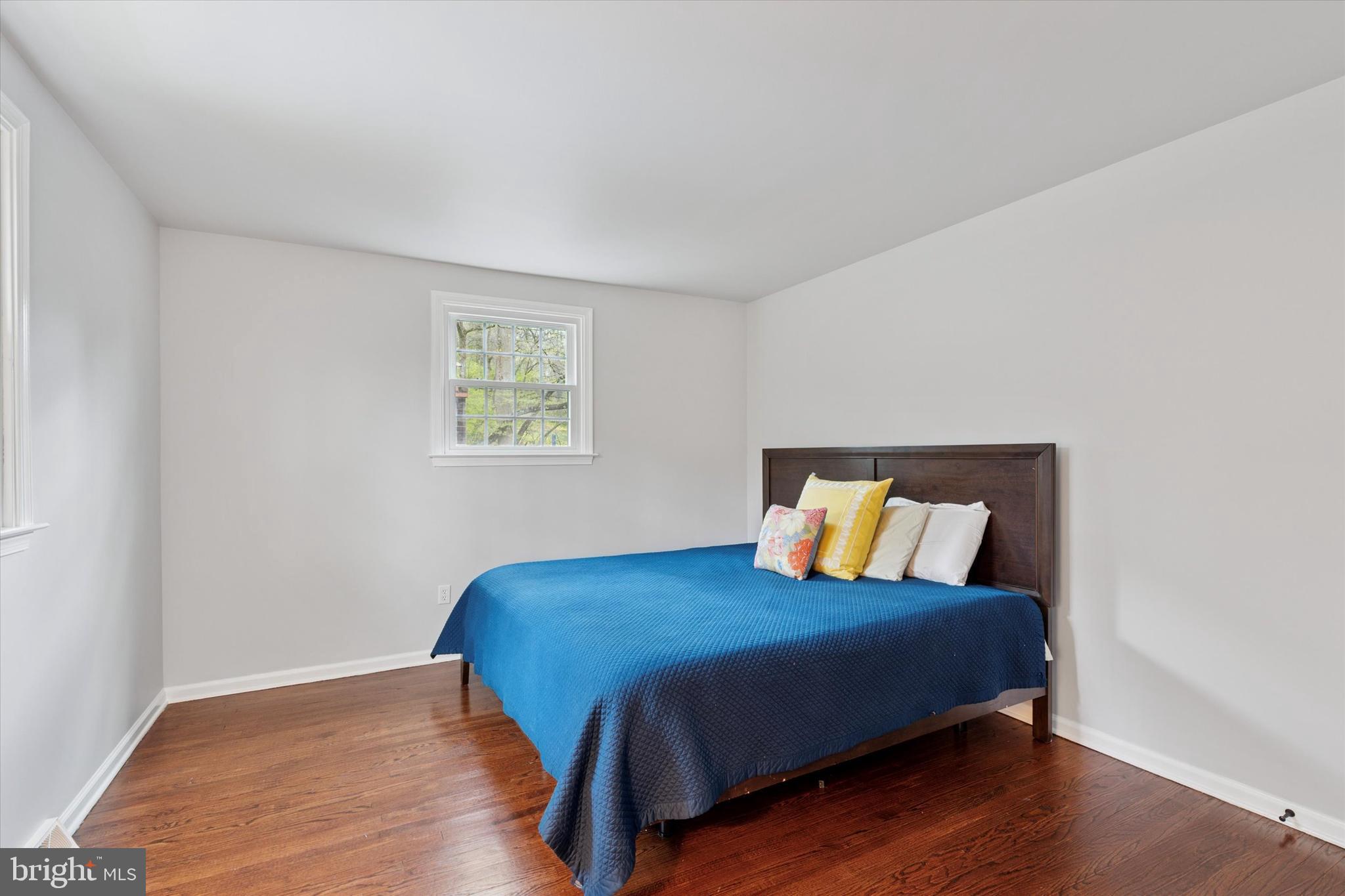 78 Peddrick Road Wayne, PA 19087 - Photo 27 of 47 a bedroom with a bed and wooden floor