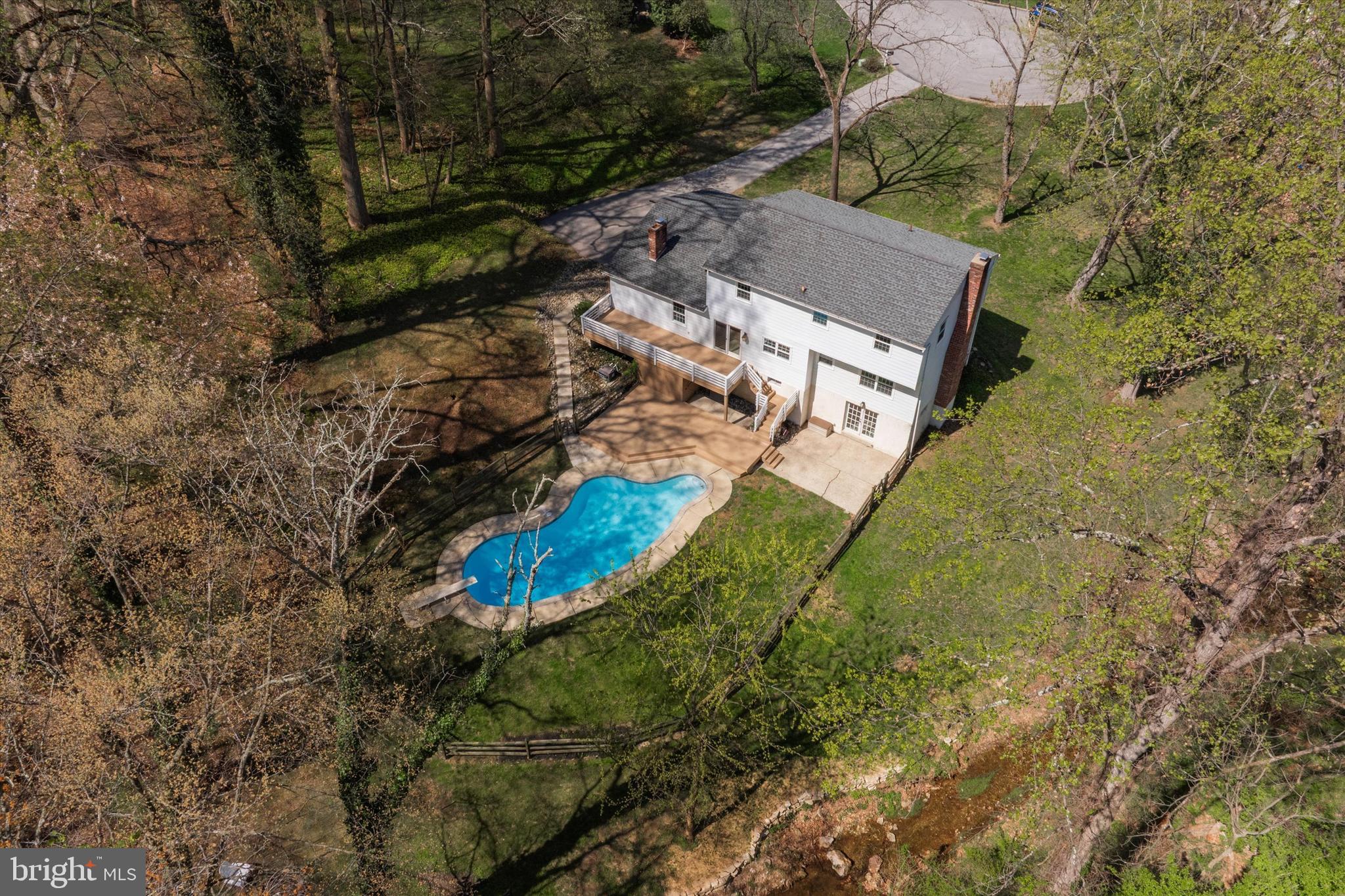 78 Peddrick Road Wayne, PA 19087 - Photo 44 of 47 an aerial view of a house with a yard and large trees