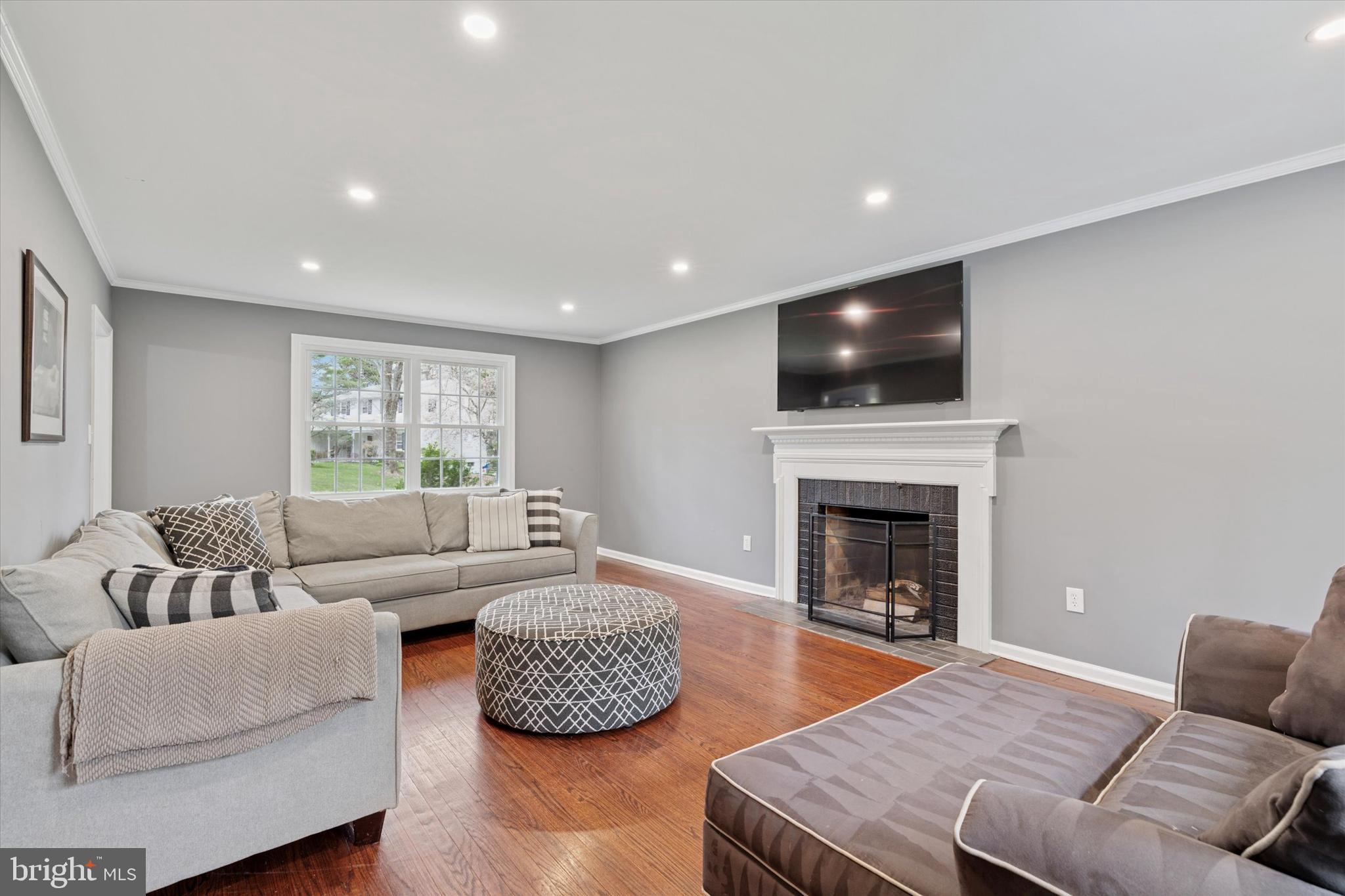 78 Peddrick Road Wayne, PA 19087 - Photo 10 of 47 a living room with furniture and a flat screen tv