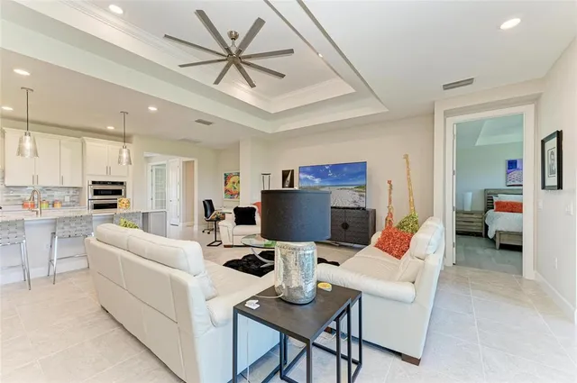 a view of a dining room with furniture and a potted plant