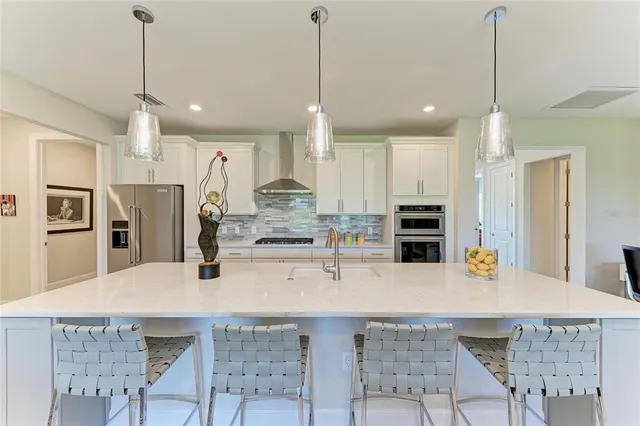a kitchen with sink refrigerator and window