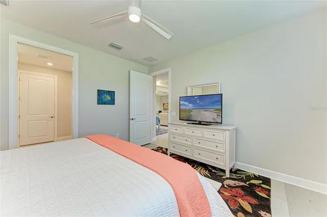 a view of a lake with houses in the background