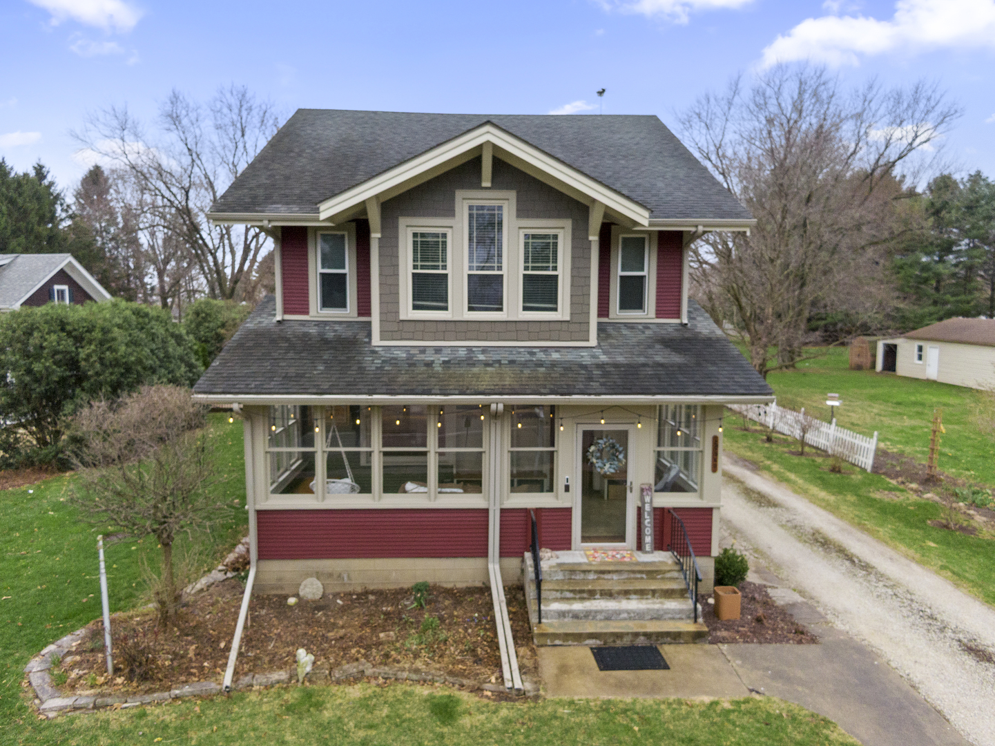 a front view of a house with a yard