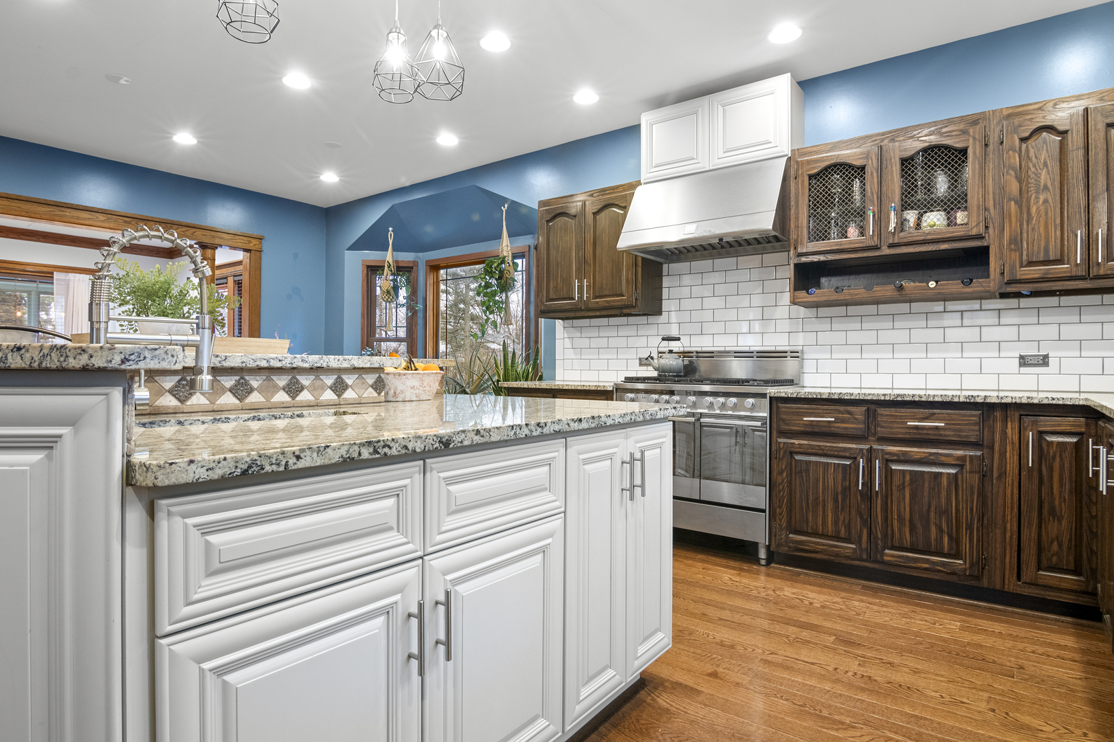 2S368 Harter Road Elburn, IL 60119 - Photo 8 of 27 a kitchen with stainless steel appliances granite countertop lots of counter top space and wooden floor