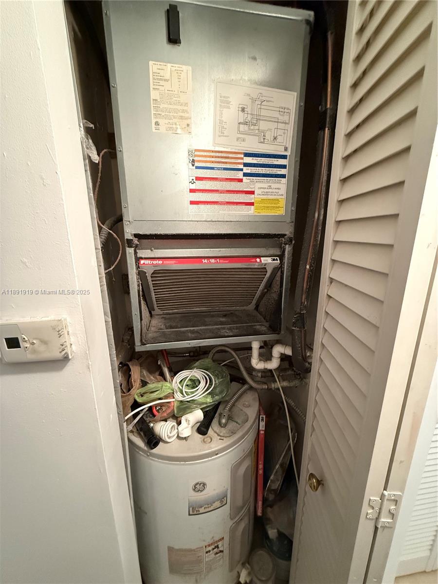 1100 Northeast 1st Court, Unit 120 Hallandale Beach, FL 33009 - Photo 24 of 45 a utility room with dryer and washer