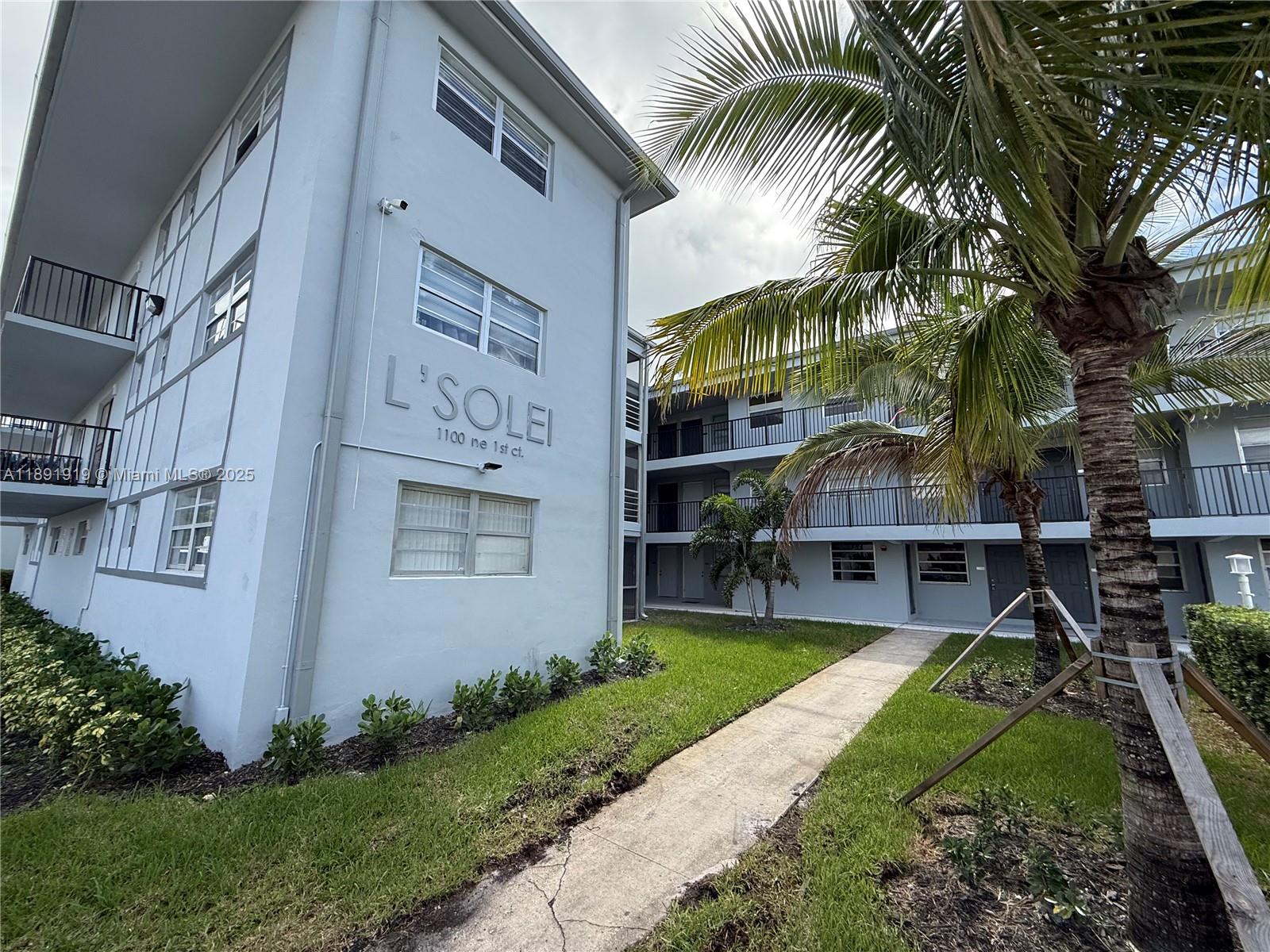 1100 Northeast 1st Court, Unit 120 Hallandale Beach, FL 33009 - Photo 45 of 45 a view of a house with a yard and plants