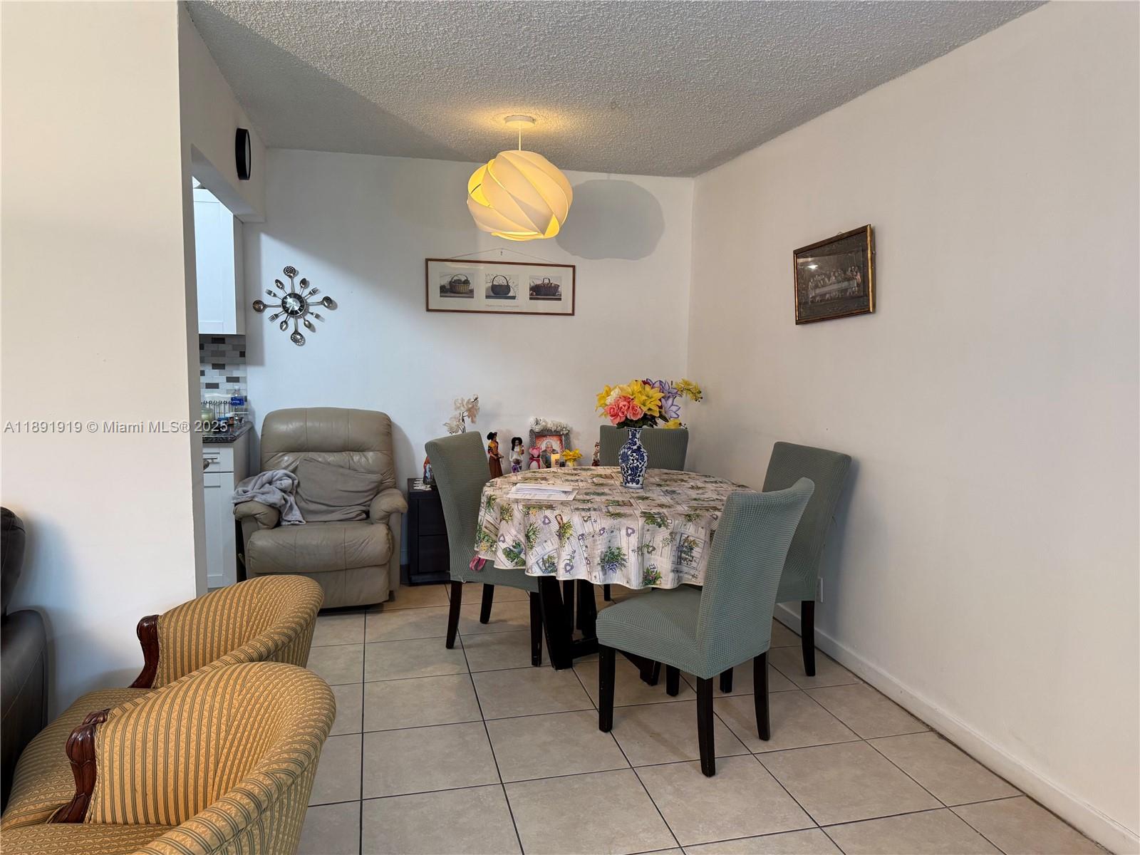 1100 Northeast 1st Court, Unit 120 Hallandale Beach, FL 33009 - Photo 9 of 45 a view of a livingroom with furniture and a couch