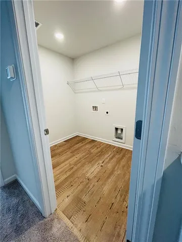 an empty room with a empty space and windows