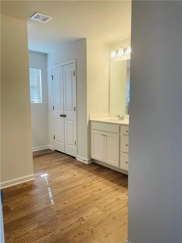 a bathroom with a glass shower door