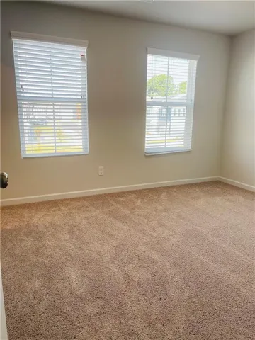 a view of a swimming pool with a yard