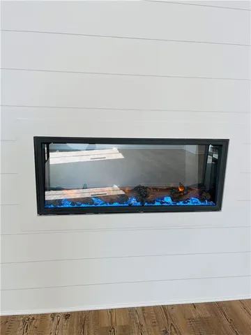 a view of a kitchen cabinets a sink and wooden floor