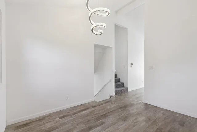 a view of an entryway with wooden floor
