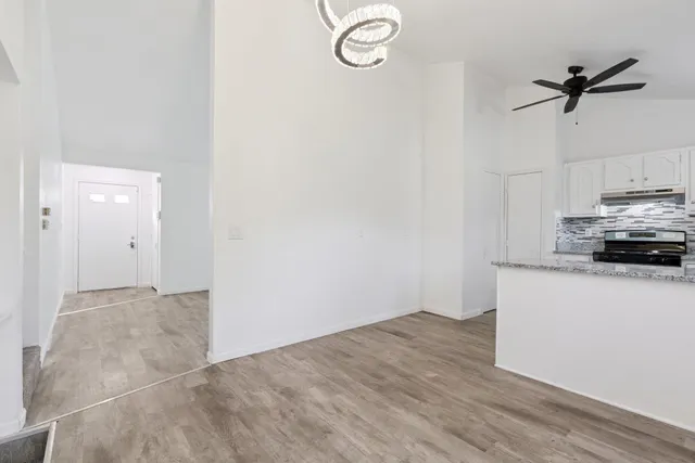 a view of a kitchen from the empty room
