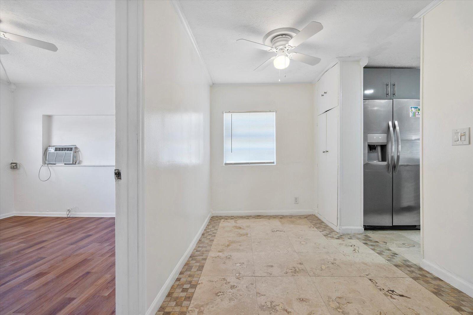 236 Southwest 14th Street Dania Beach, FL 33004 - Photo 13 of 19 an empty room with closet and a ceiling fan