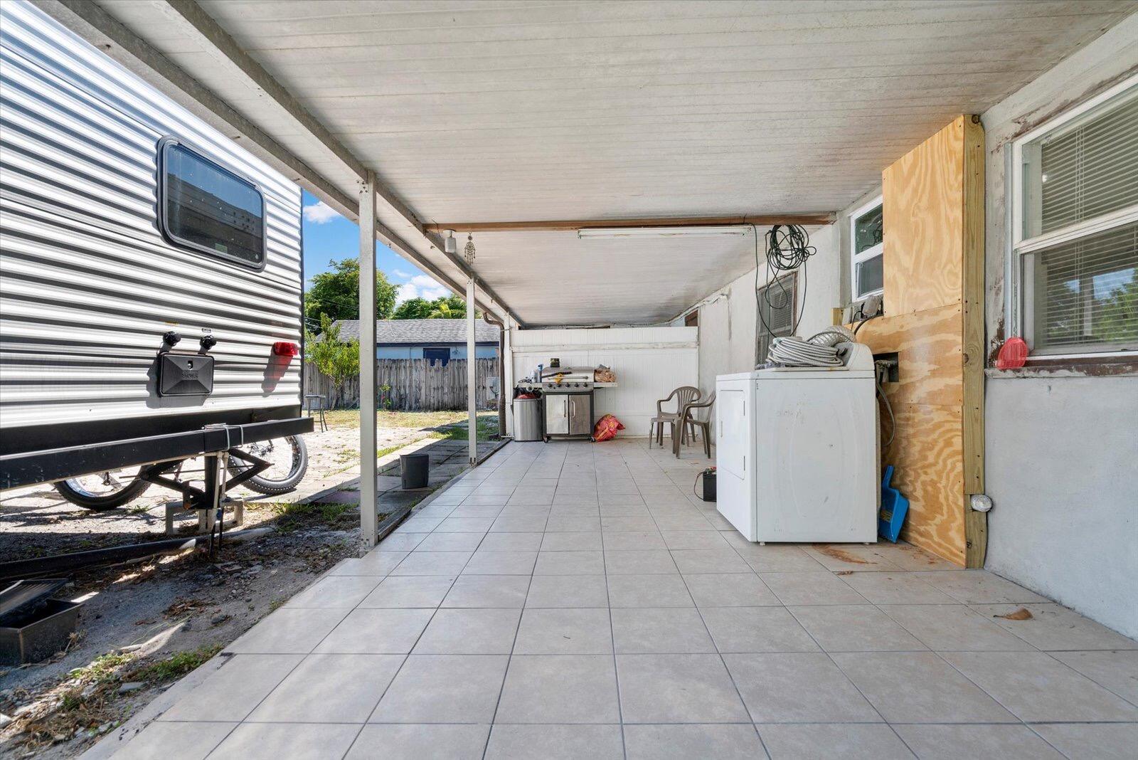 236 Southwest 14th Street Dania Beach, FL 33004 - Photo 19 of 19 a view of a porch with wooden floor