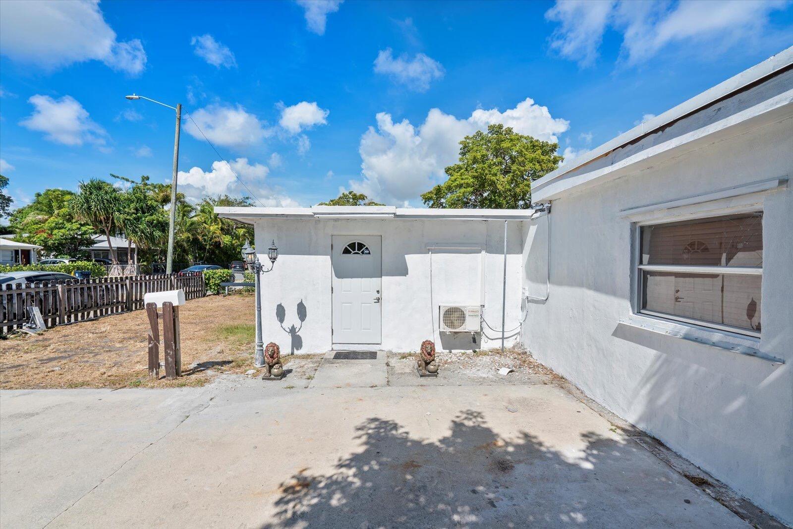 236 Southwest 14th Street Dania Beach, FL 33004 - Photo 2 of 19 a view of a patio with a table and chairs