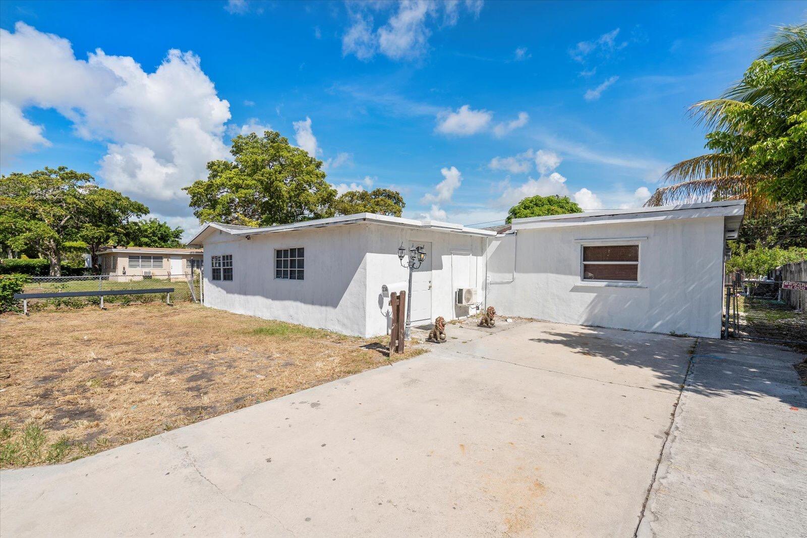 236 Southwest 14th Street Dania Beach, FL 33004 - Photo 4 of 19 a view of a house with a patio