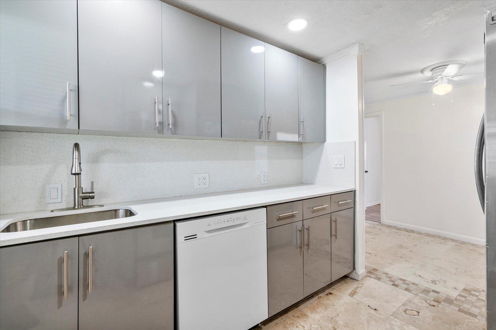 236 Southwest 14th Street Dania Beach, FL 33004 - Photo 7 of 19 a kitchen with a sink and cabinets