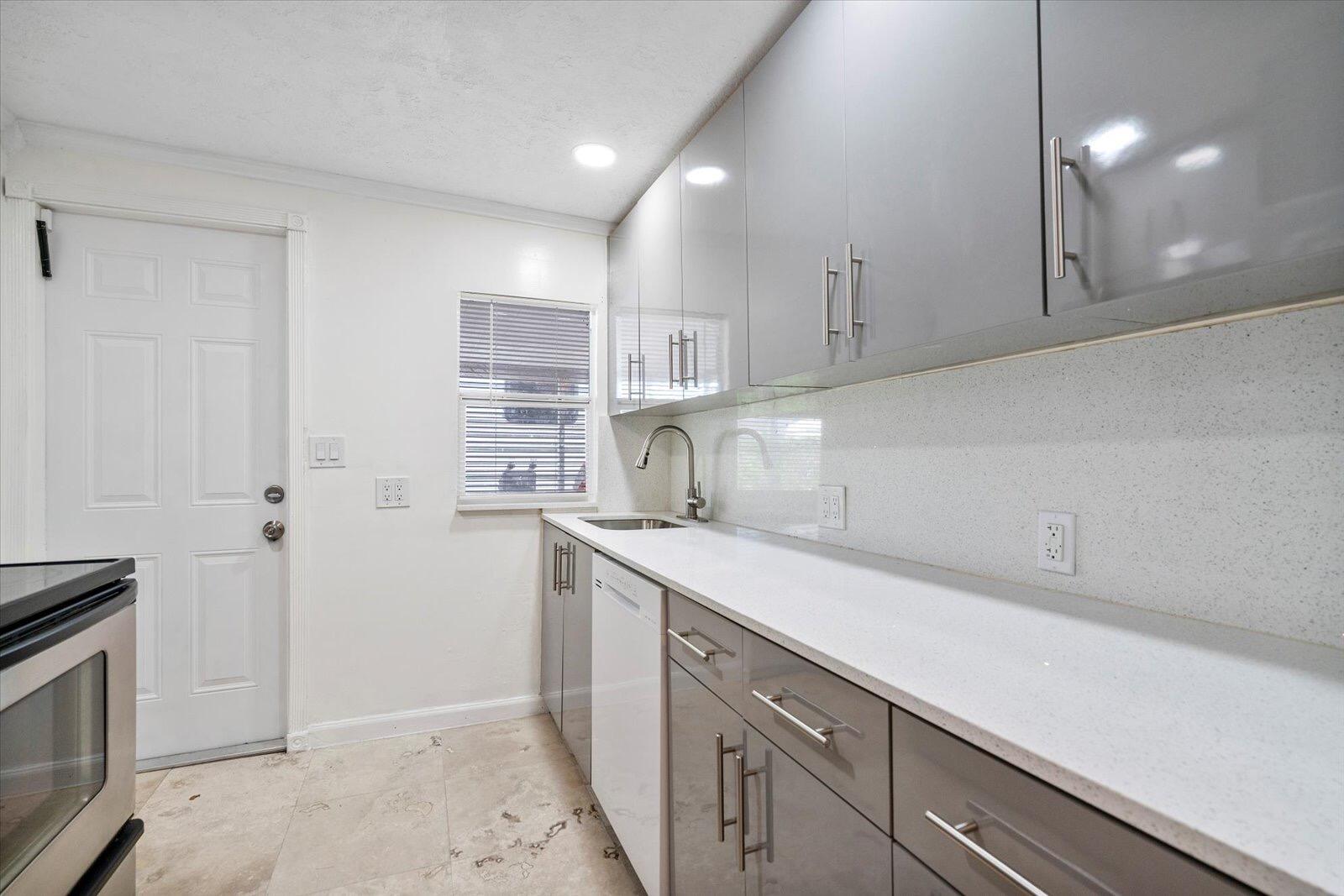 236 Southwest 14th Street Dania Beach, FL 33004 - Photo 8 of 19 a kitchen with a sink and cabinets
