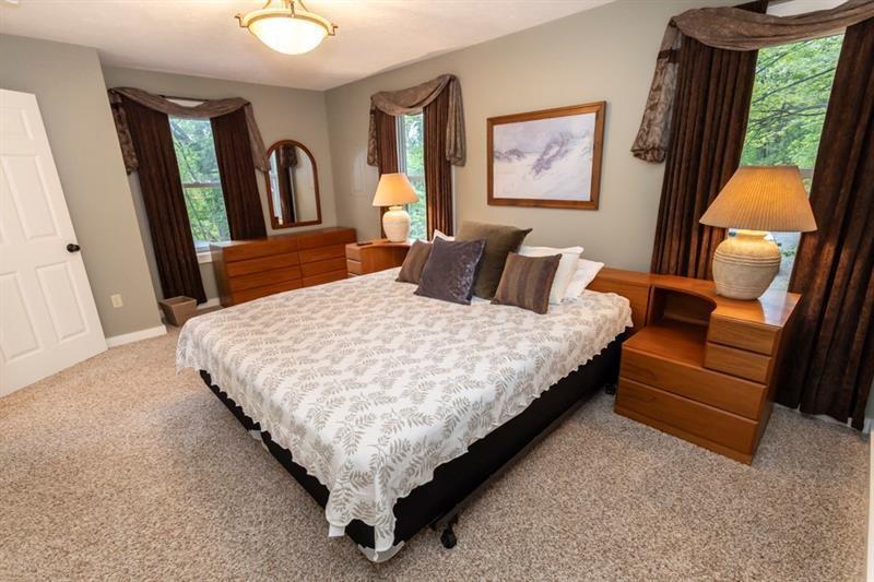 2226 County Line Road Champion, PA 15622 - Photo 29 of 33 a bed sitting in a bedroom next to a window