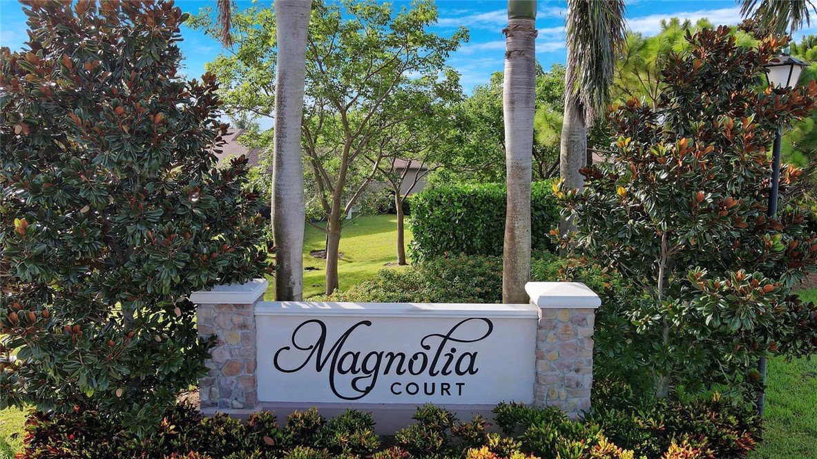 5288 Jasper Square Vero Beach, FL 32967 - Photo 7 of 7 a sign that is sitting on a brick wall