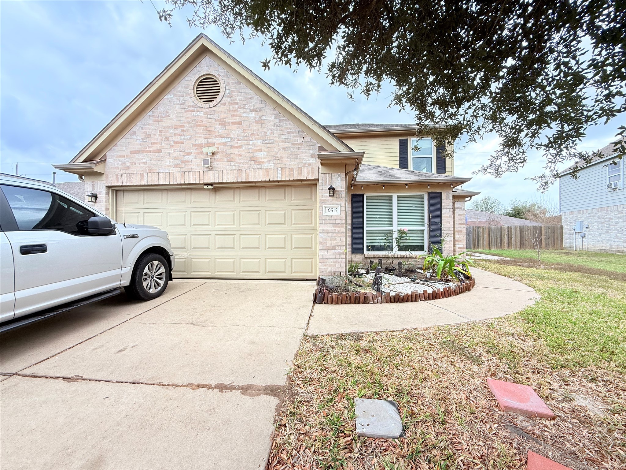 a view of a house with a yard and garage