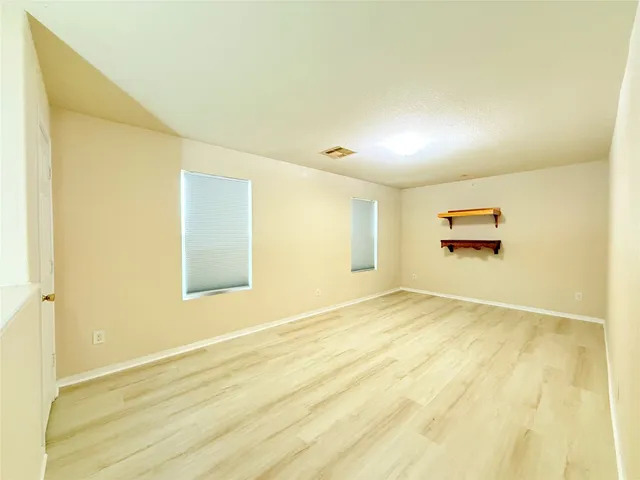 a view of a room with a wooden floor
