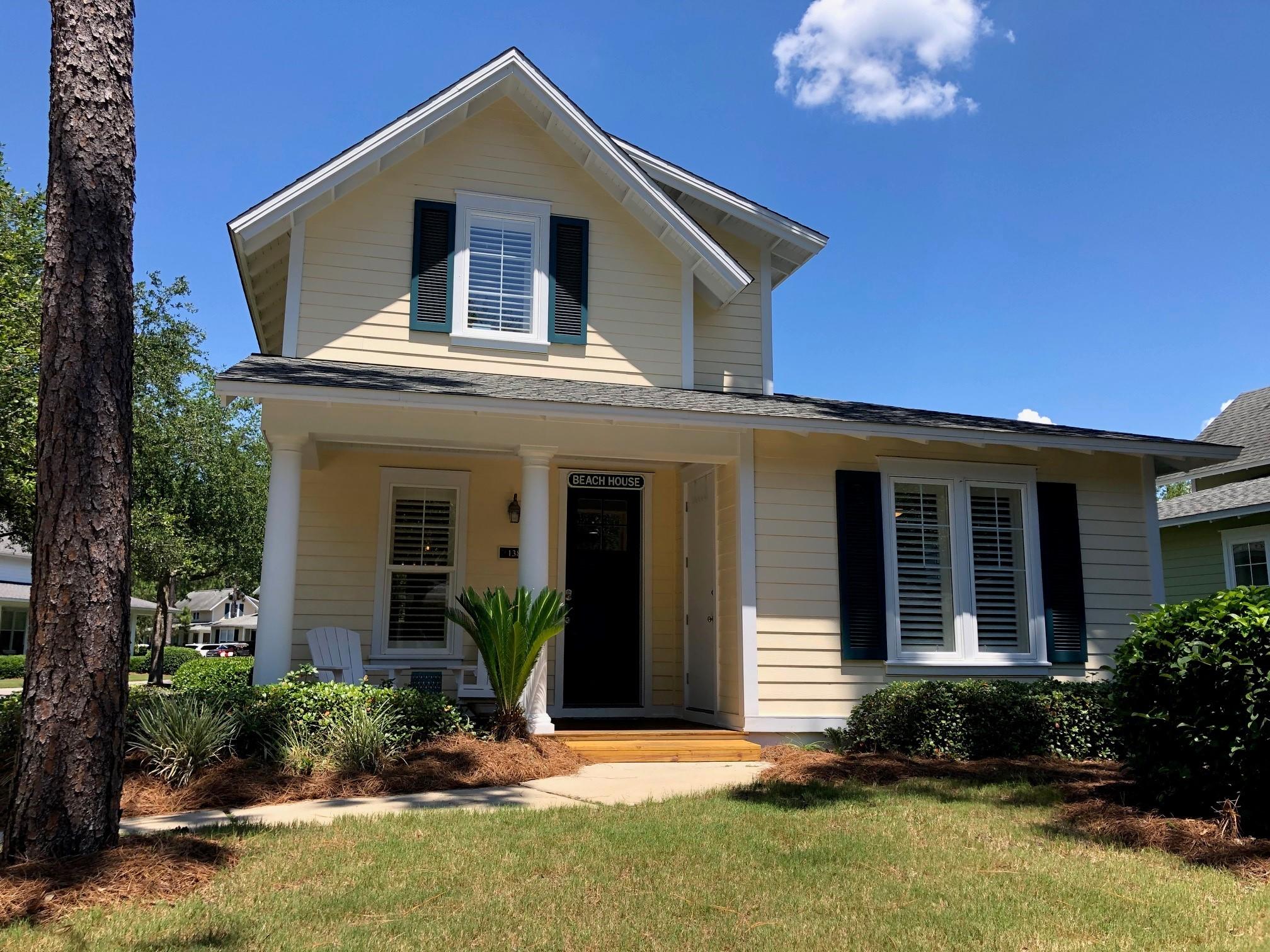1384 Ravens Run West Miramar Beach, FL 32550 - Photo 2 of 21 a front view of a house with a yard