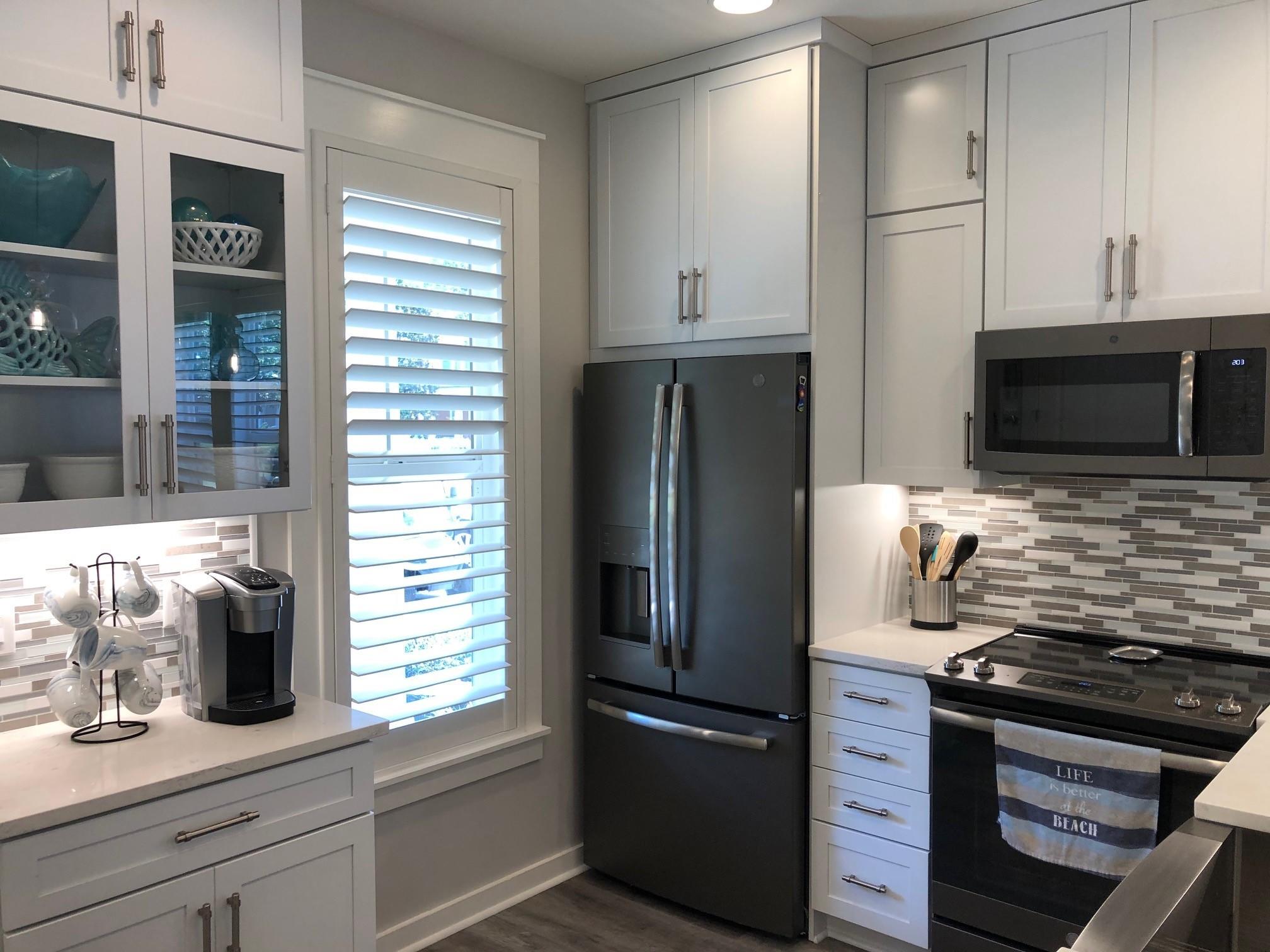1384 Ravens Run West Miramar Beach, FL 32550 - Photo 11 of 21 a kitchen with a refrigerator and a sink