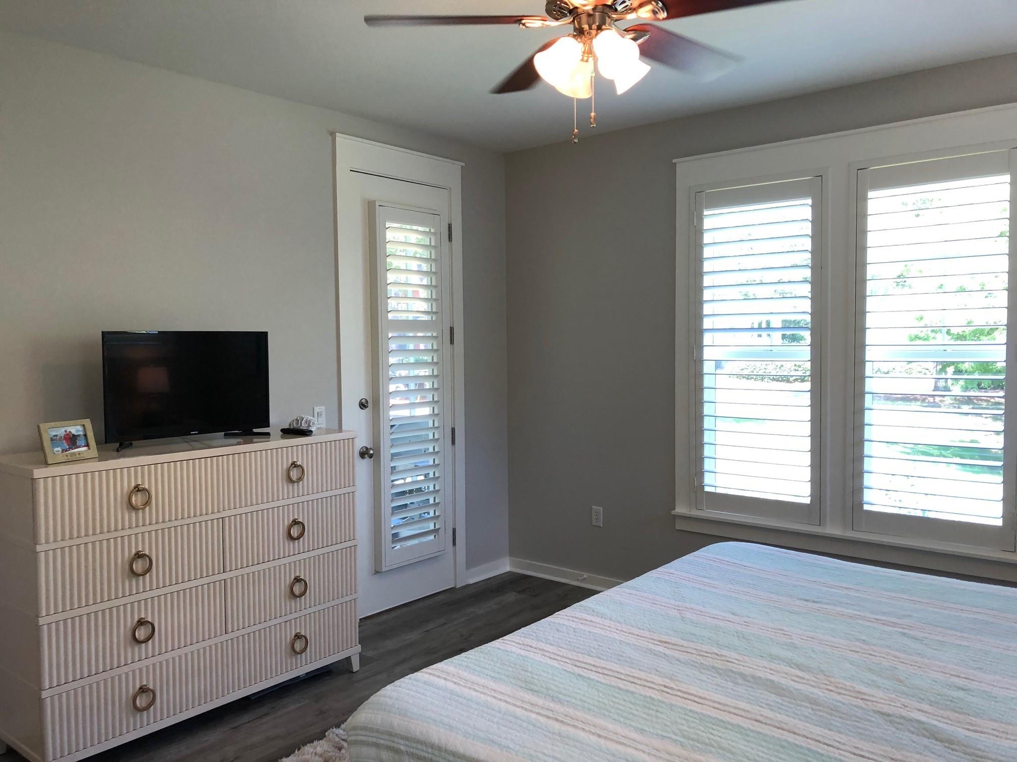 1384 Ravens Run West Miramar Beach, FL 32550 - Photo 17 of 21 a hotel room with bed and a flat tv screen on dresser