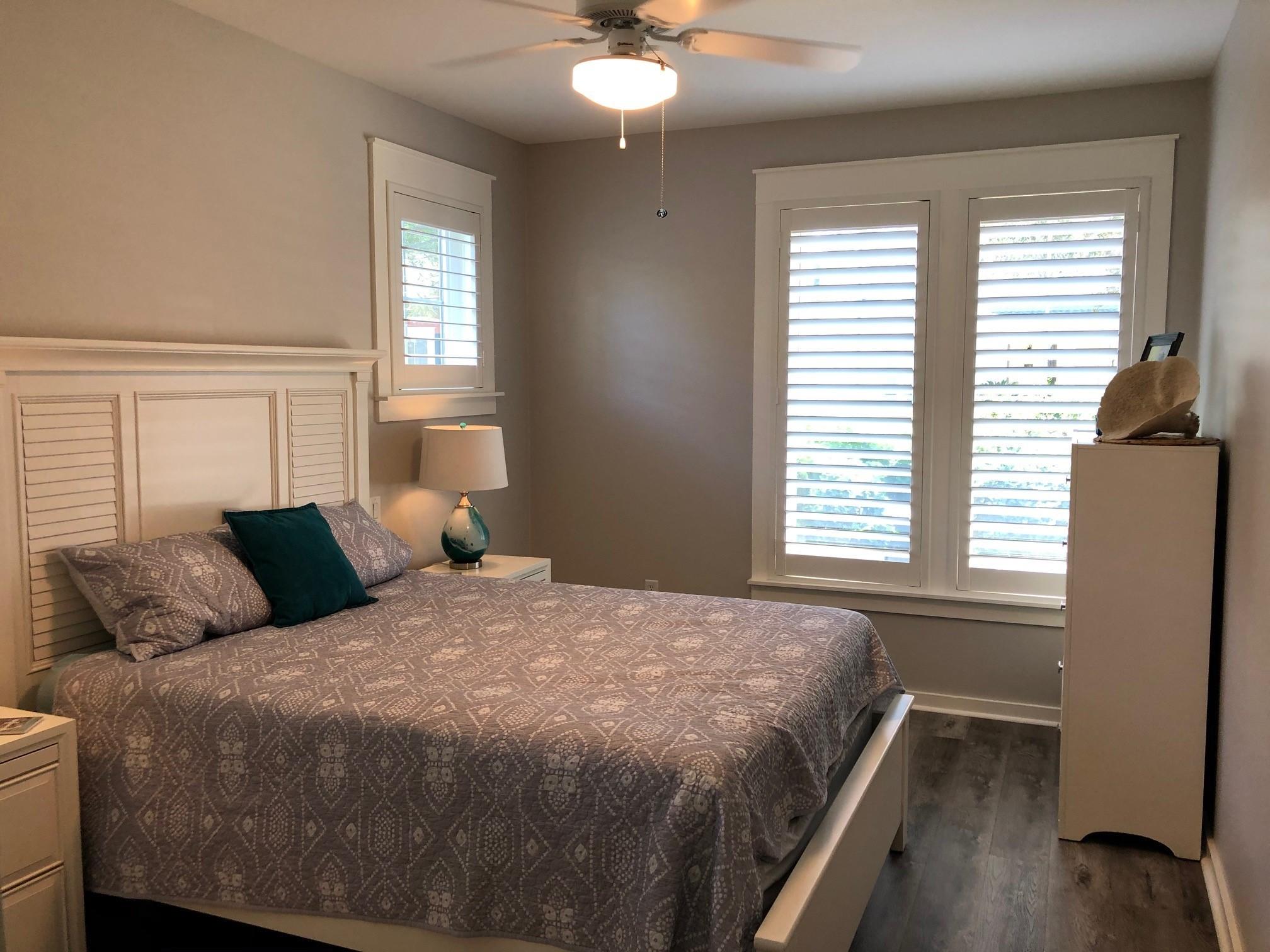 1384 Ravens Run West Miramar Beach, FL 32550 - Photo 19 of 21 a bedroom with a bed and window