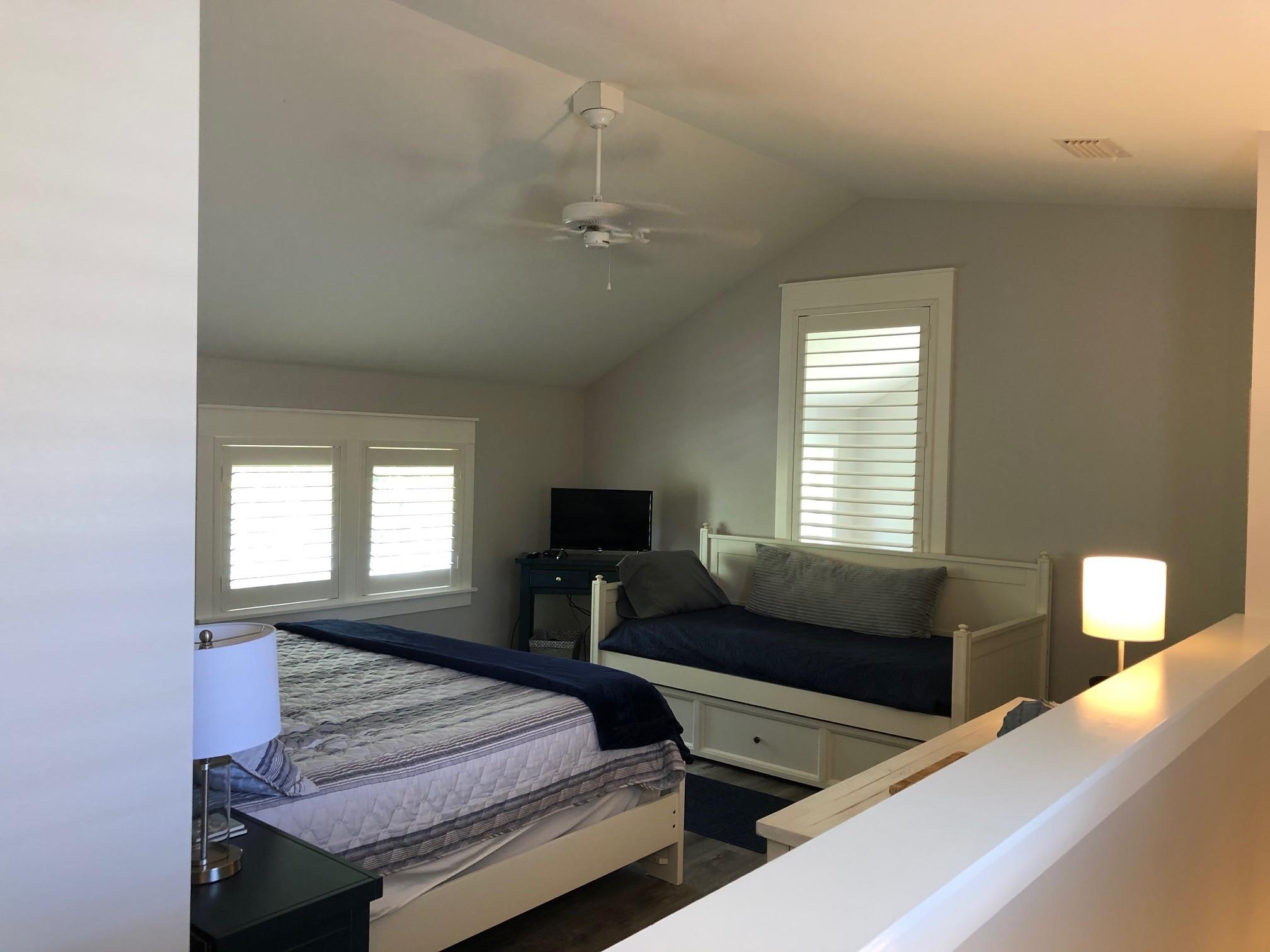 1384 Ravens Run West Miramar Beach, FL 32550 - Photo 20 of 21 a bedroom with a bed and a window