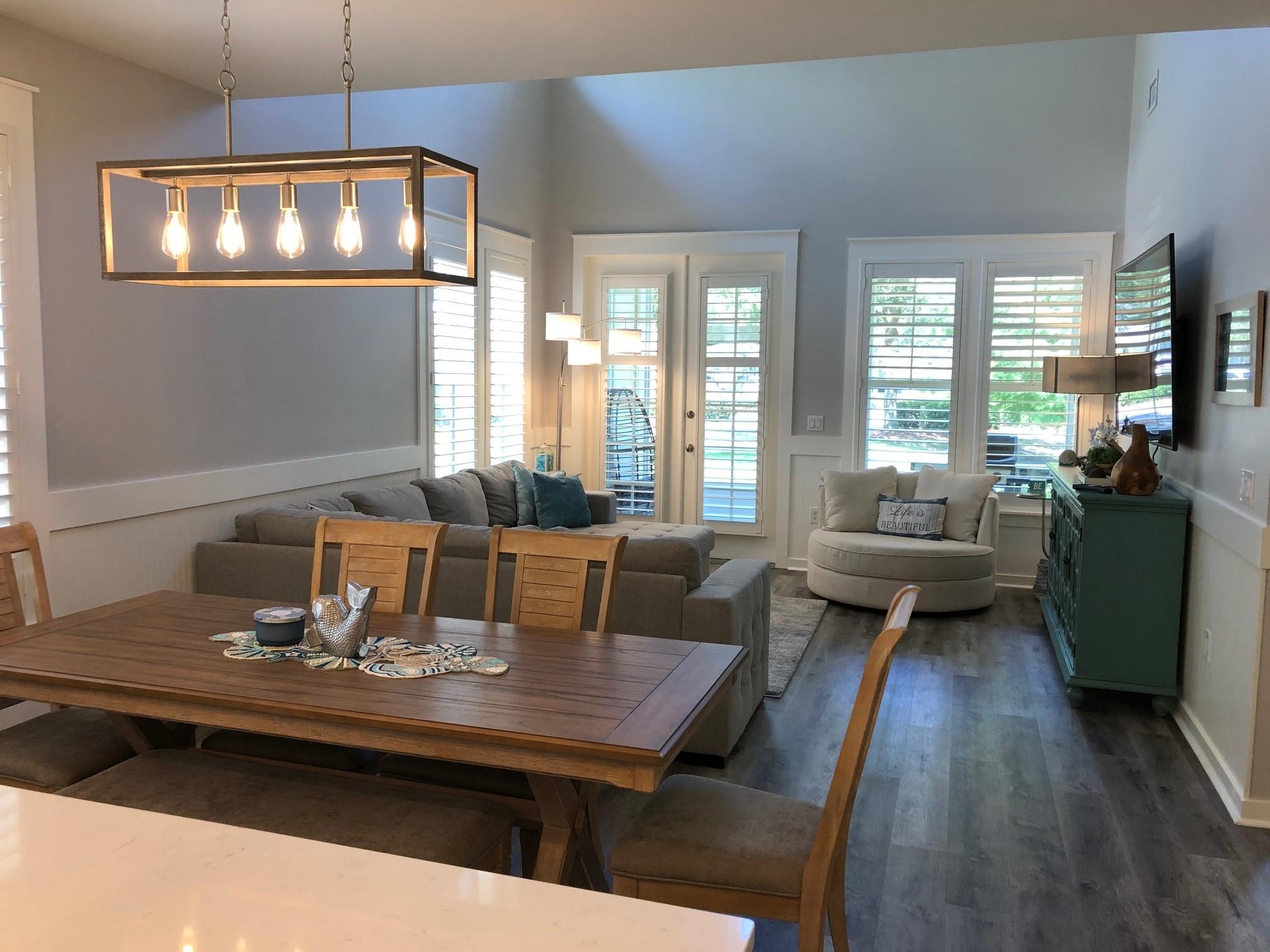 1384 Ravens Run West Miramar Beach, FL 32550 - Photo 8 of 21 a living room with furniture a chandelier and a table
