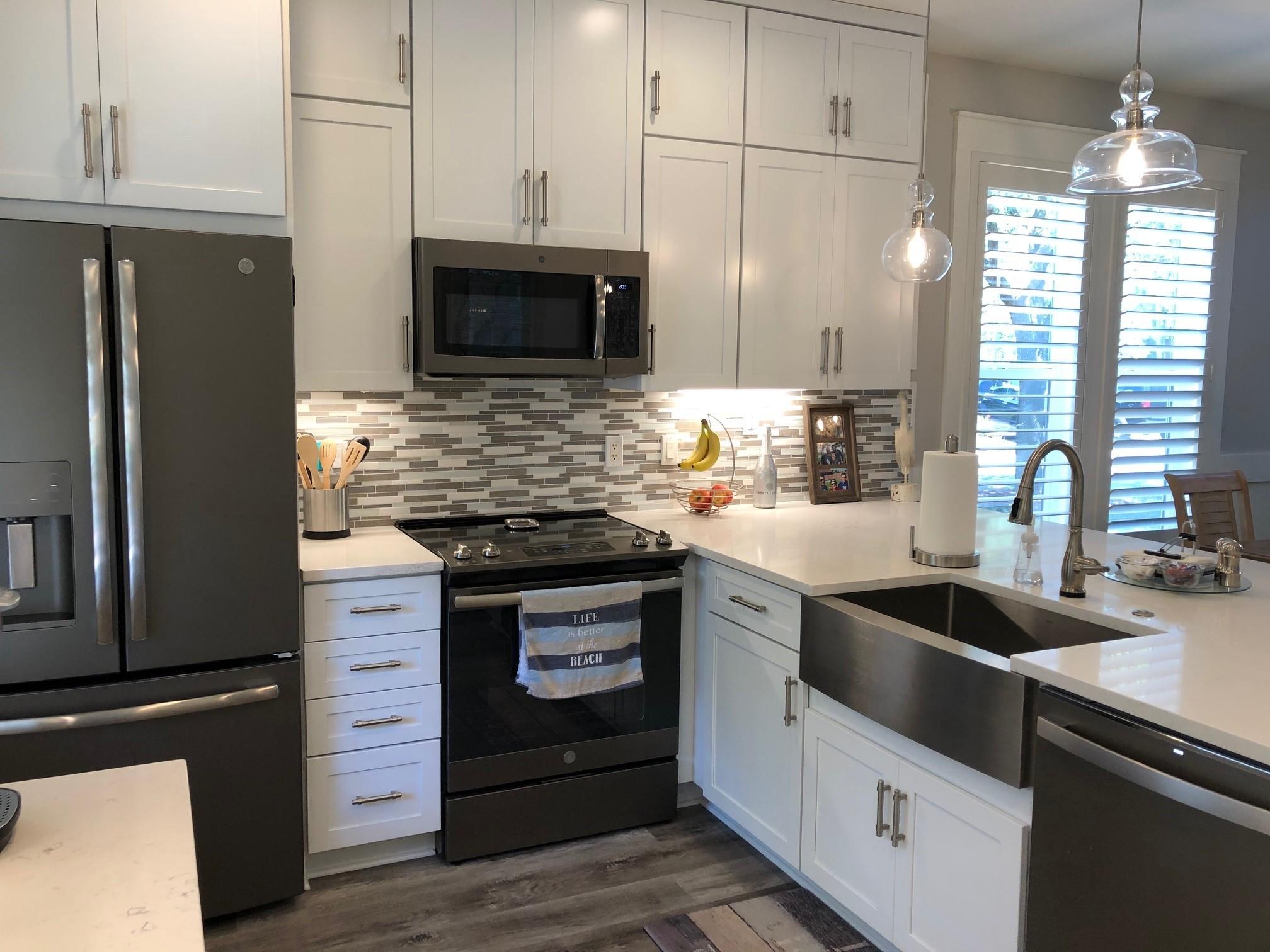 1384 Ravens Run West Miramar Beach, FL 32550 - Photo 10 of 21 a kitchen with granite countertop a sink stainless steel appliances and cabinets