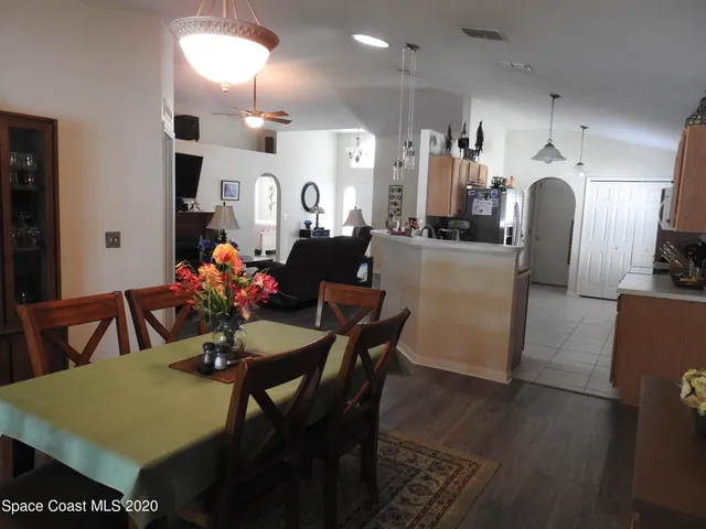 a view of a dining room with furniture