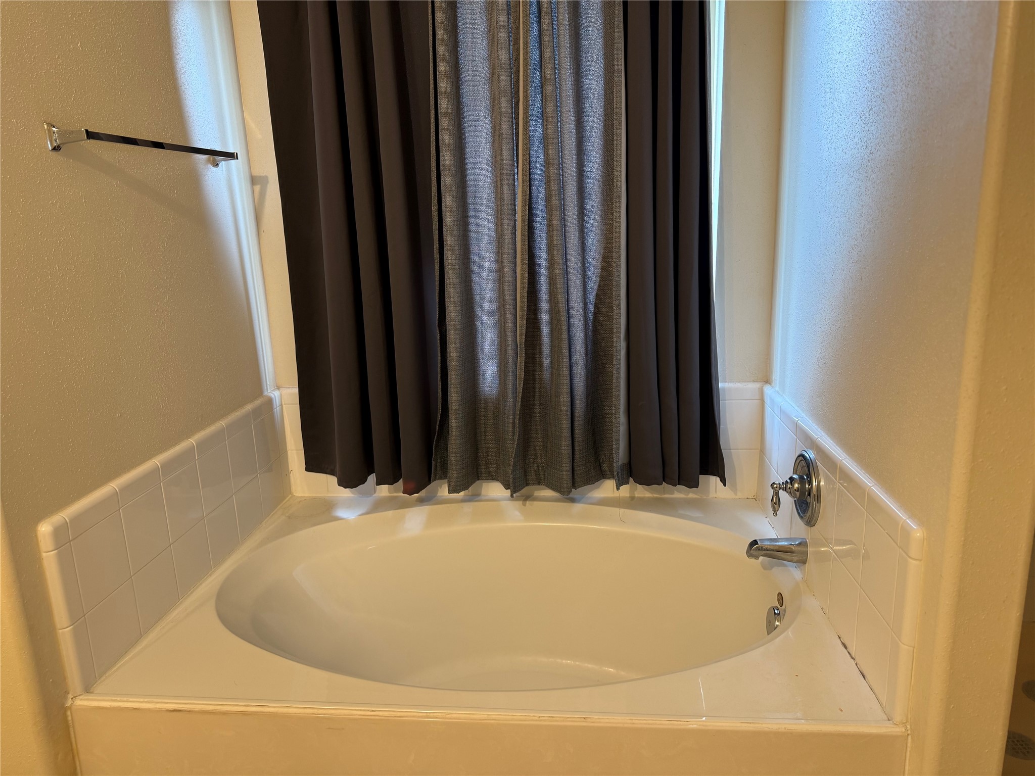 13715 Audra Lane Houston, TX 77083 - Photo 15 of 25 a white bath tub sitting in a bathroom