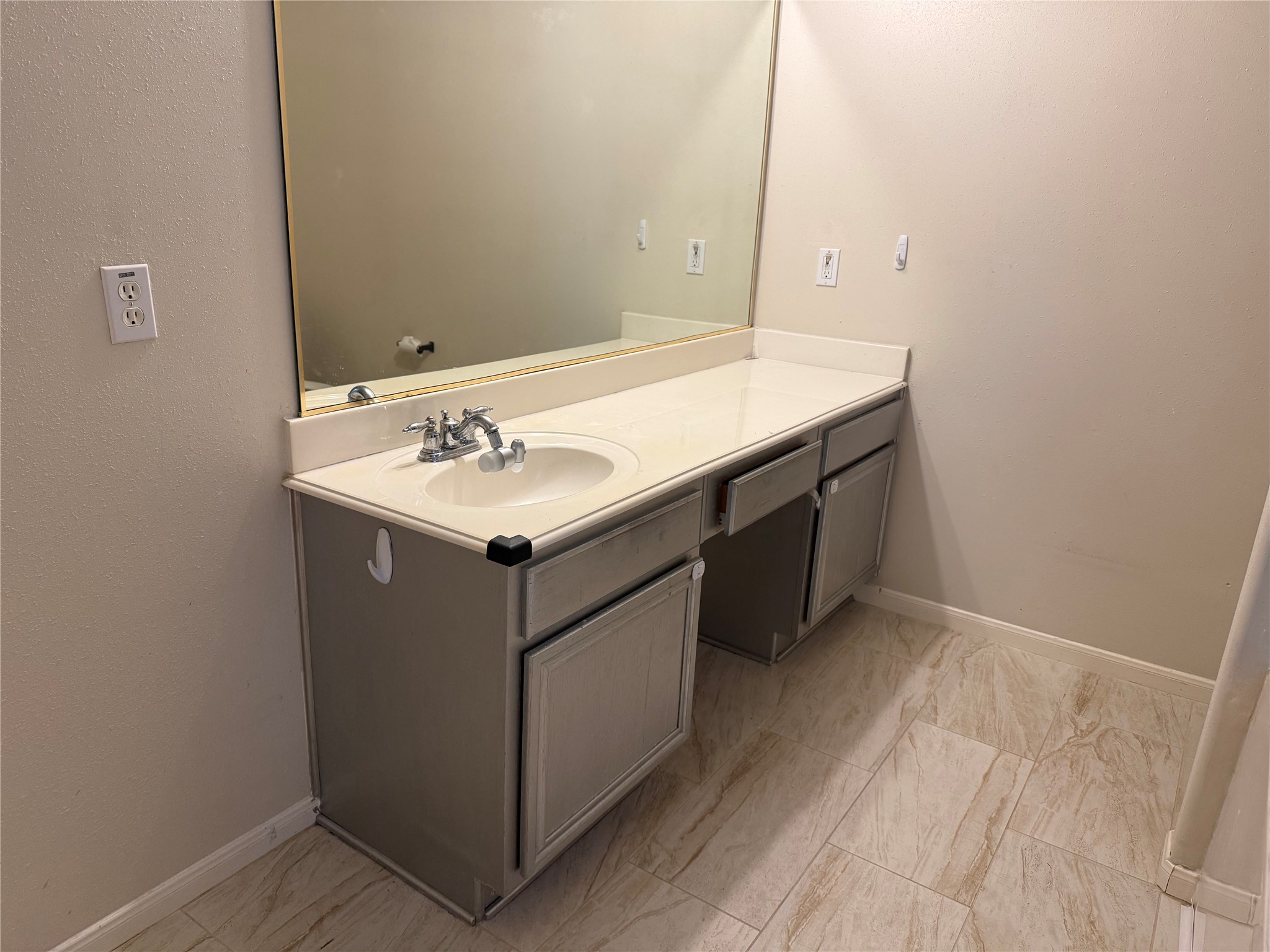 13715 Audra Lane Houston, TX 77083 - Photo 16 of 25 a bathroom with a sink and a mirror