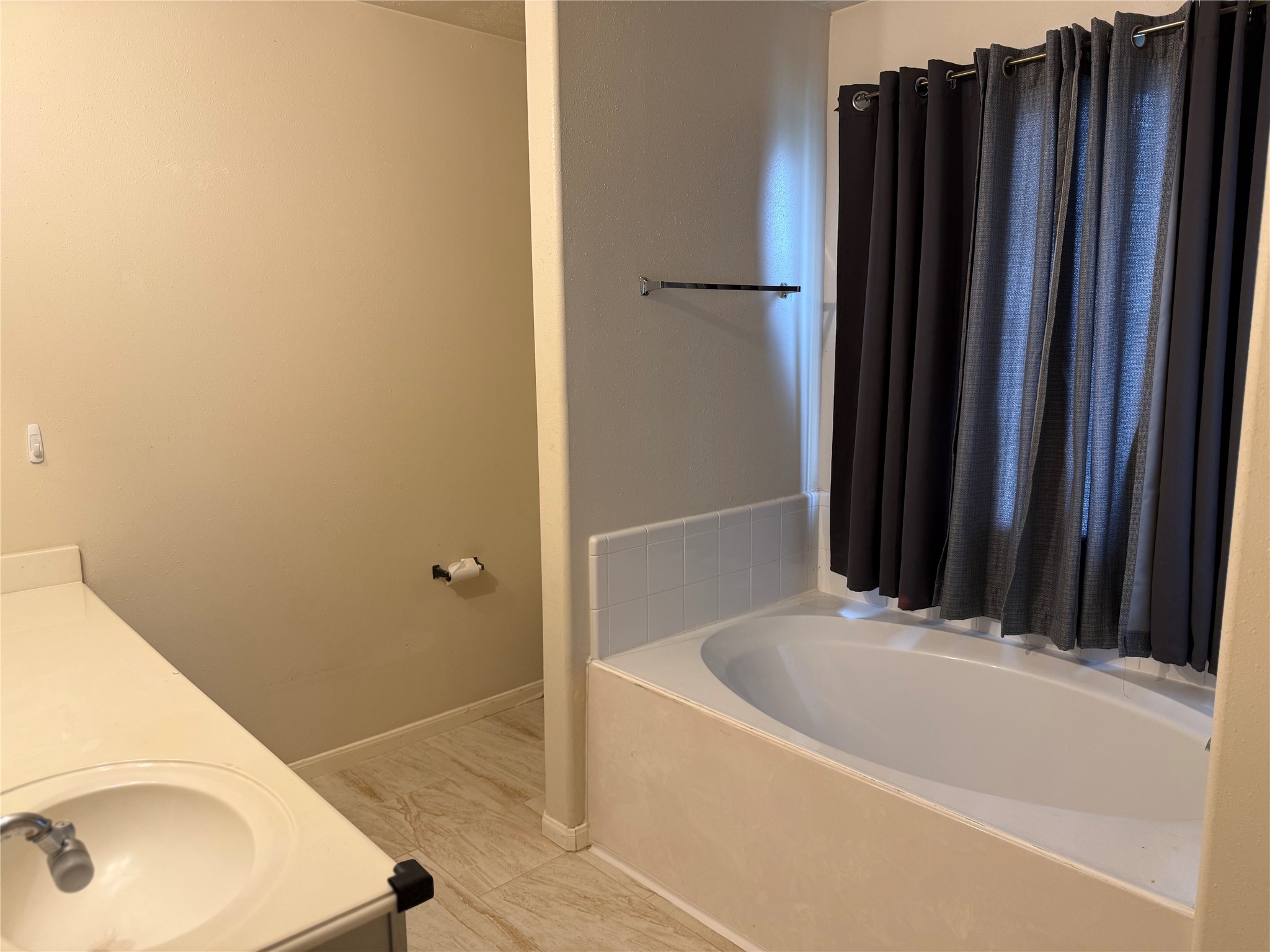13715 Audra Lane Houston, TX 77083 - Photo 17 of 25 a bathroom with a sink and a bathtub