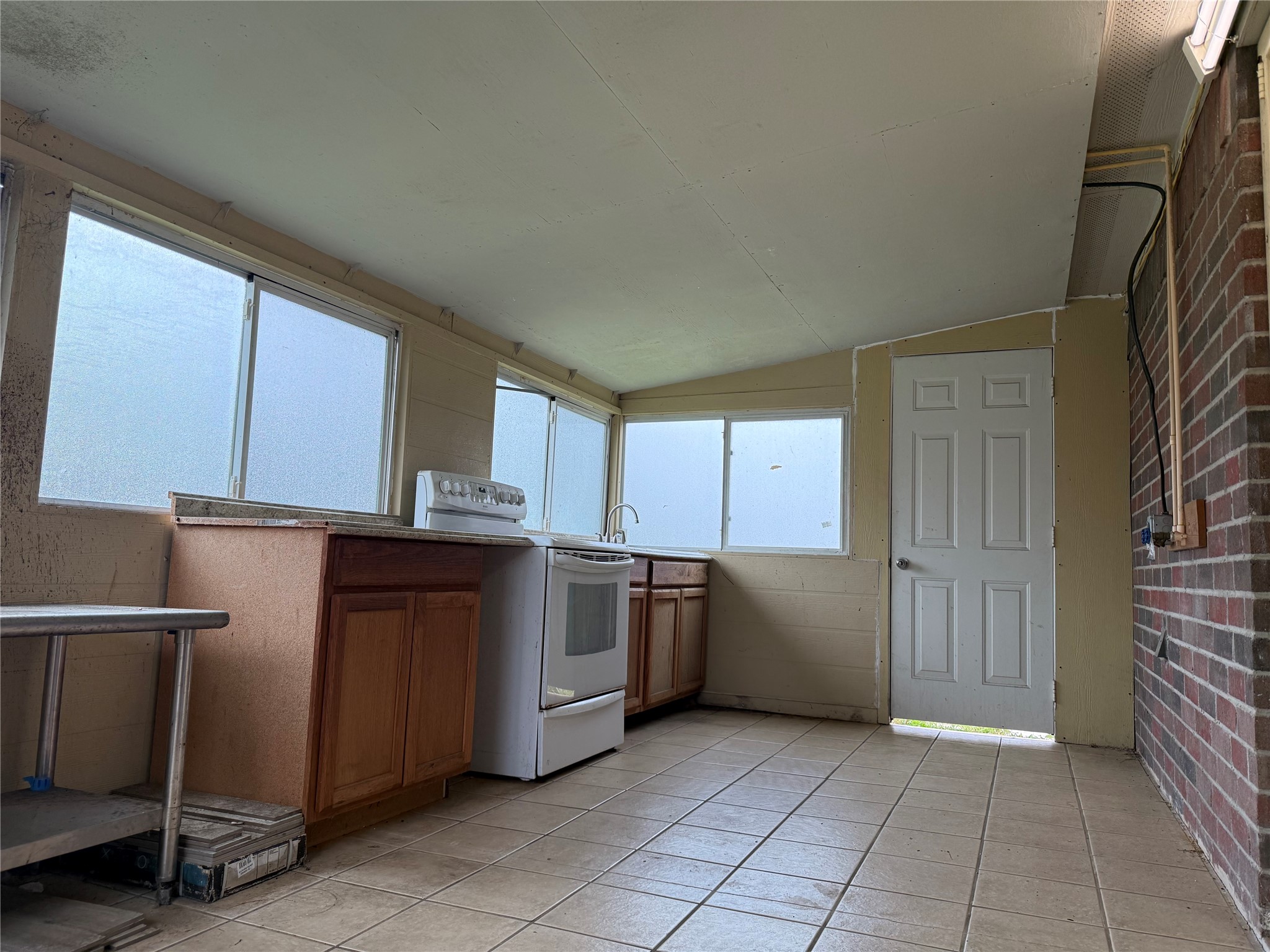 13715 Audra Lane Houston, TX 77083 - Photo 22 of 25 a kitchen with granite countertop a refrigerator and cabinets