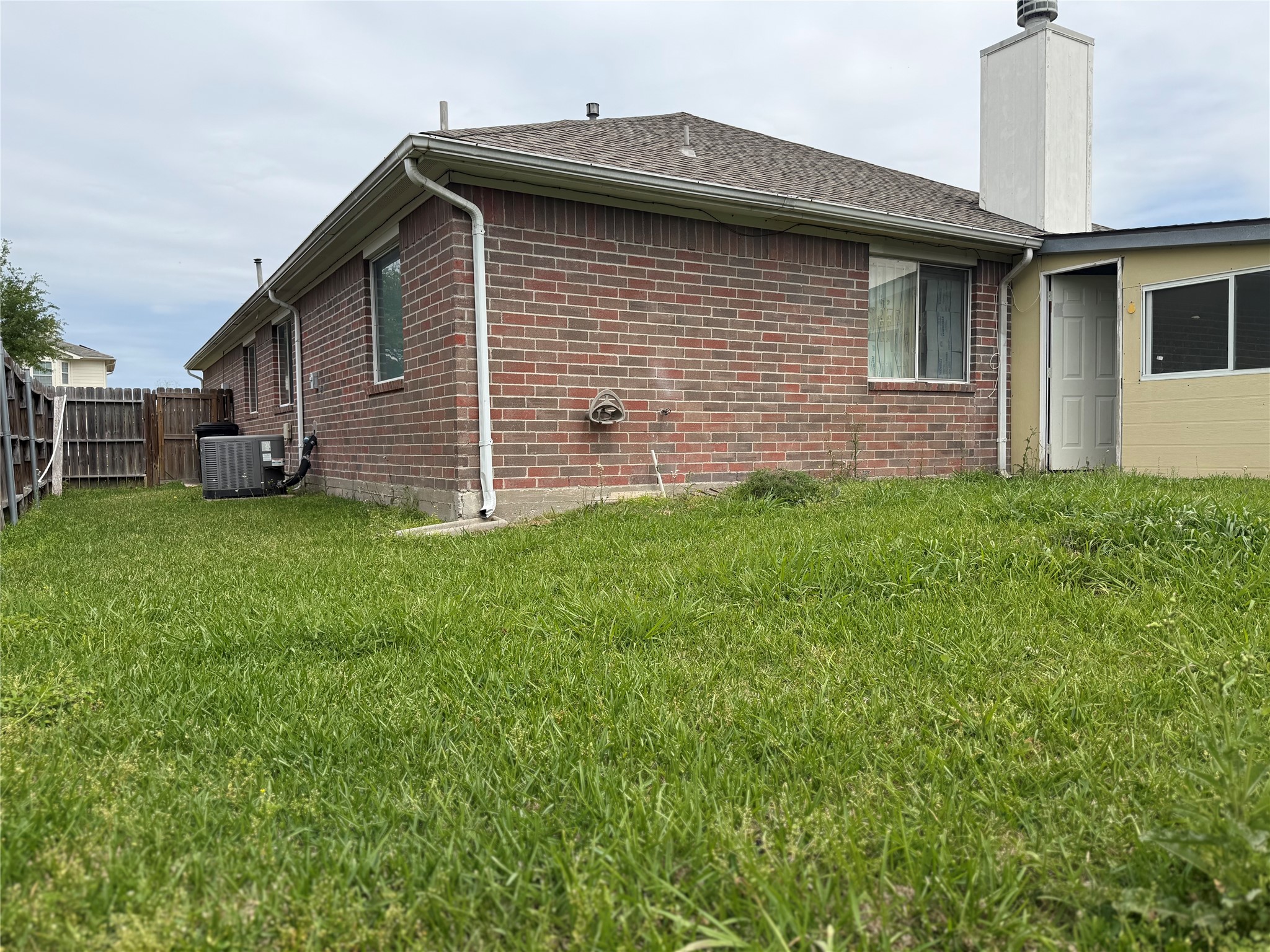 13715 Audra Lane Houston, TX 77083 - Photo 24 of 25 a front view of a house with a yard