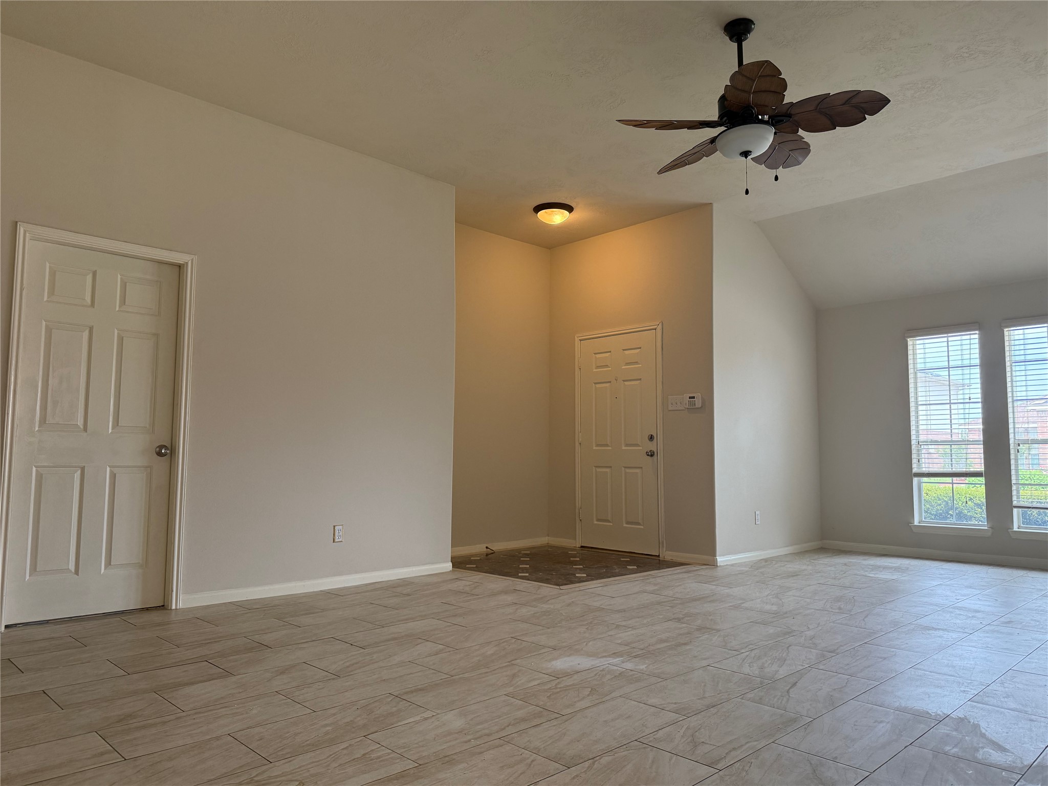 13715 Audra Lane Houston, TX 77083 - Photo 3 of 25 a view of an empty room and a window