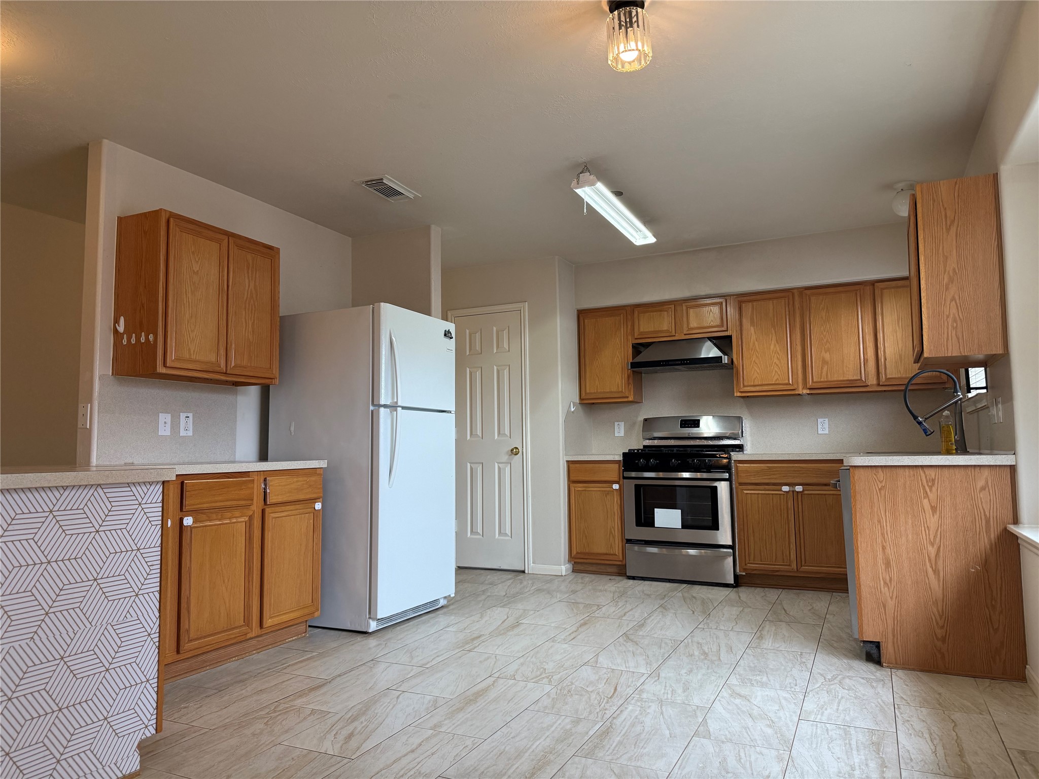 13715 Audra Lane Houston, TX 77083 - Photo 6 of 25 a kitchen with stainless steel appliances granite countertop a refrigerator a stove top oven a sink and dishwasher